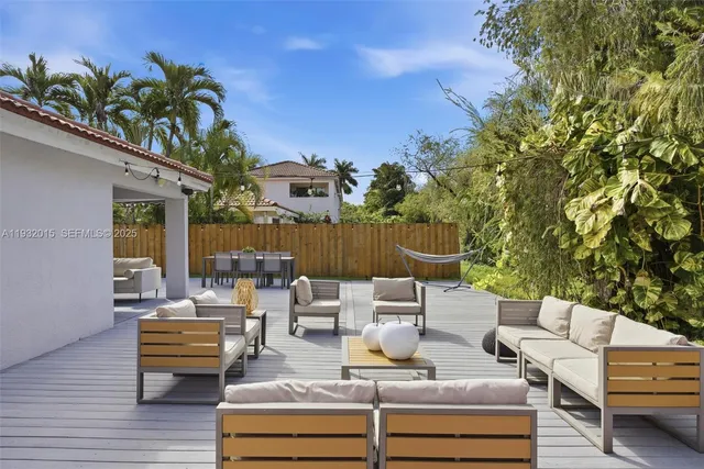 a view of swimming pool with furniture