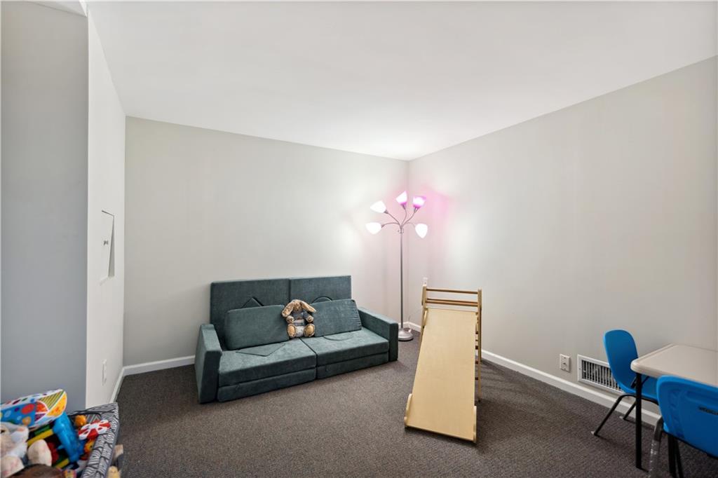 131 Fox Run Road Cranberry Township, PA 16066 - Photo 23 of 31 A bonus room in the basement currently used as a playroom is versatile. The small hatch in the left wall is access to the water meter.