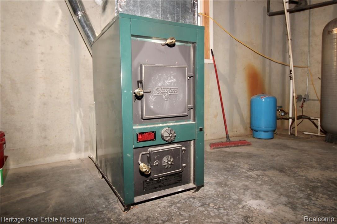10550 East Prior Road Gaines, MI 48436 - Photo 23 of 28 Basement Wood Stove Heater
