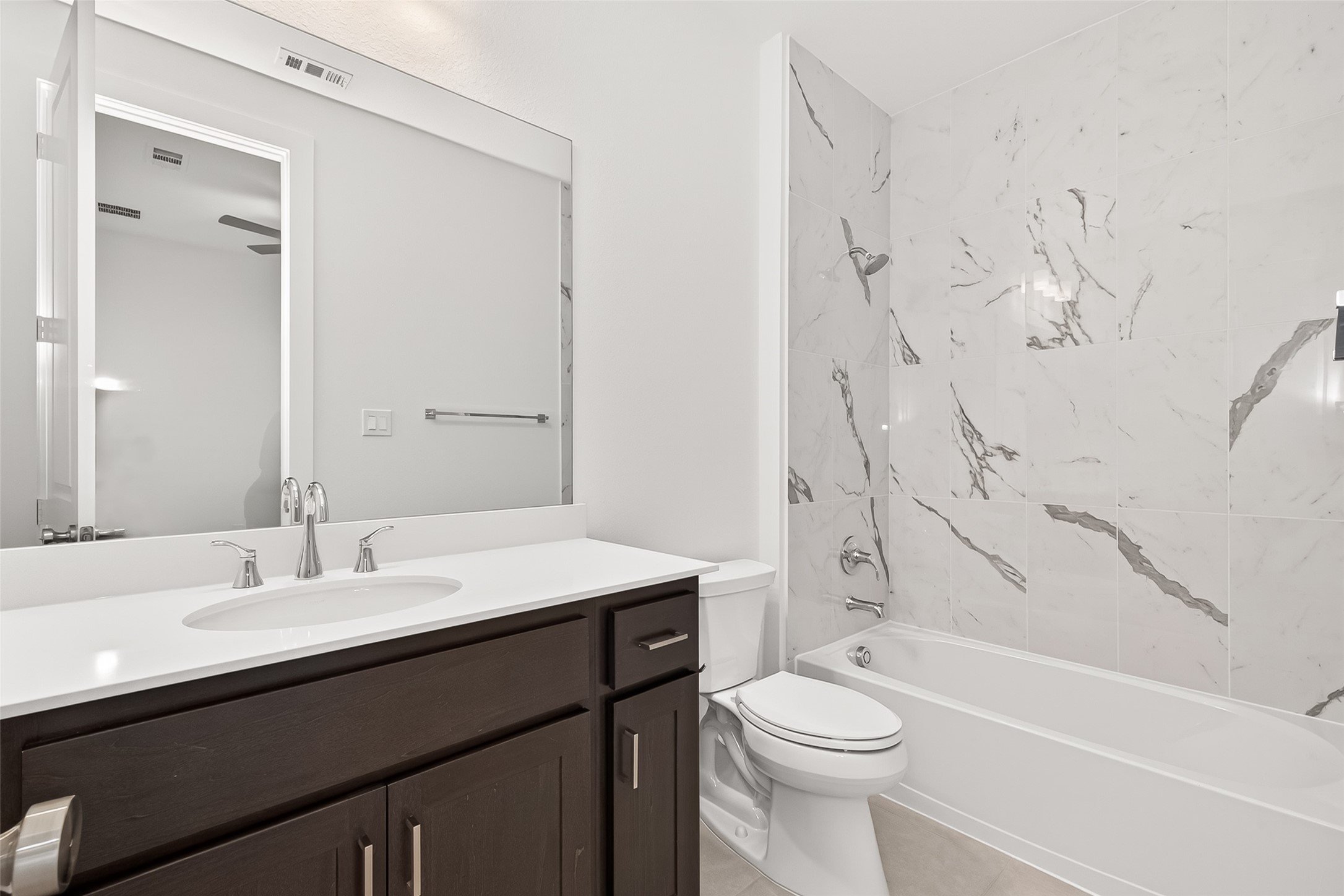4916 Northern Wds Drive Spring, TX 77386 - Photo 30 of 44 a bathroom with a sink a toilet and shower