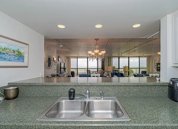 a kitchen with sink and couch