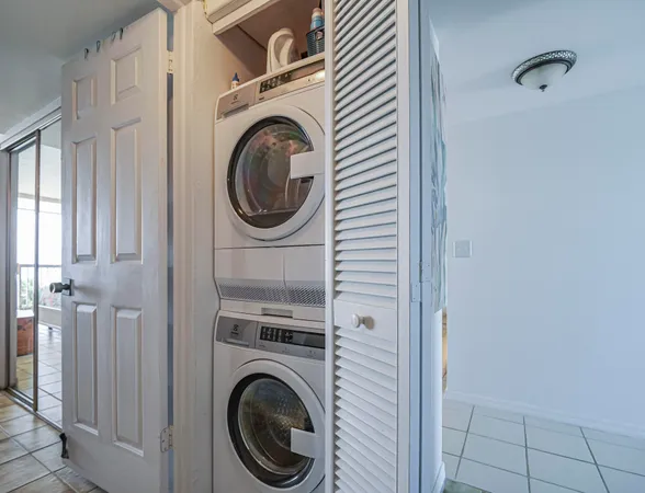 a view of a hallway with washer and dryer