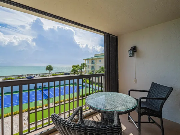 a view of a balcony with furniture