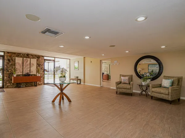 a living room with furniture and a large window