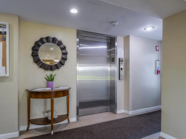 a front view of a gallery with wooden floor