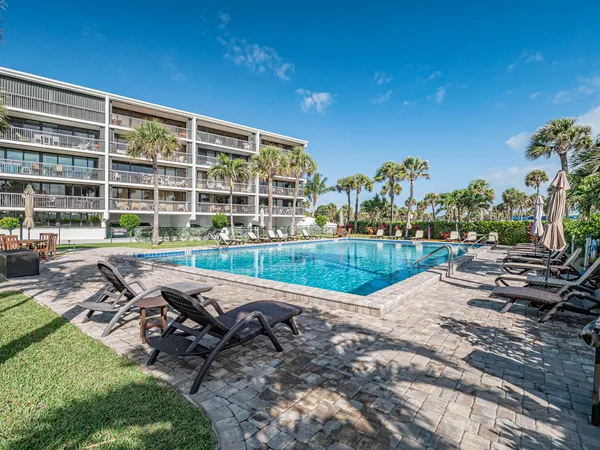 a view of swimming pool with outdoor space and seating area