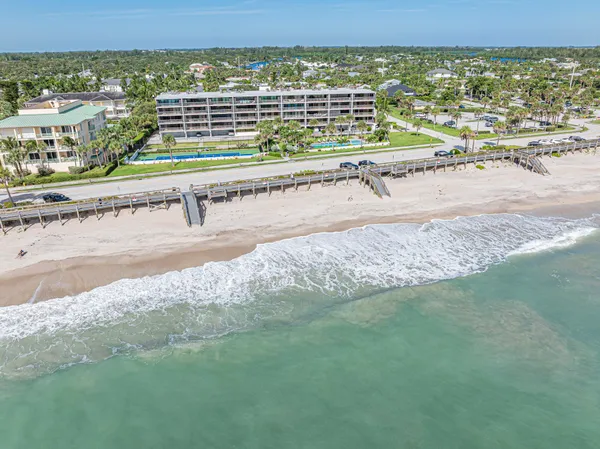 a view of a balcony with wooden floor