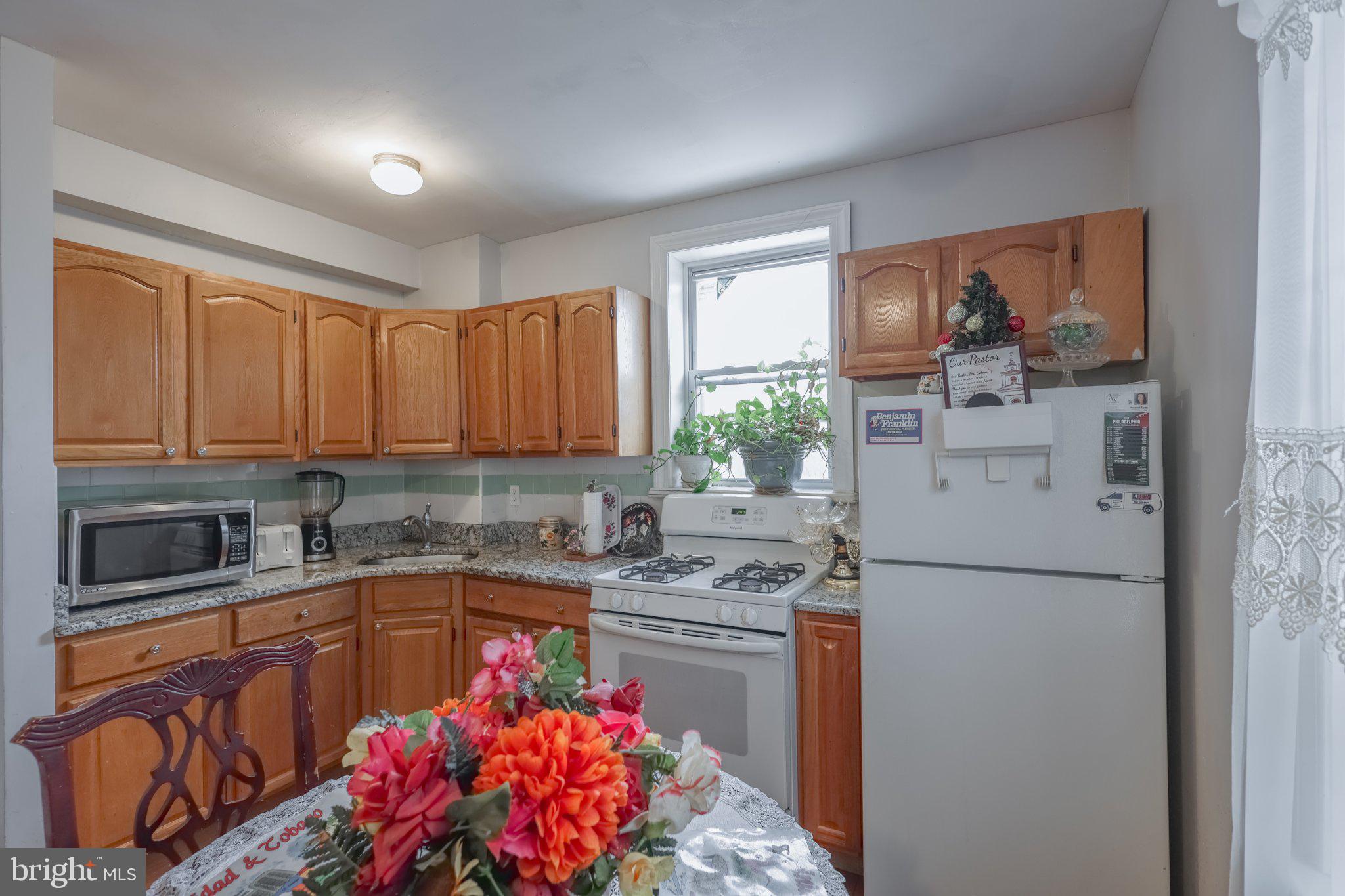 912 Ridge Avenue Darby, PA 19023 - Photo 11 of 28 Cozy kitchen with warm wooden tones.