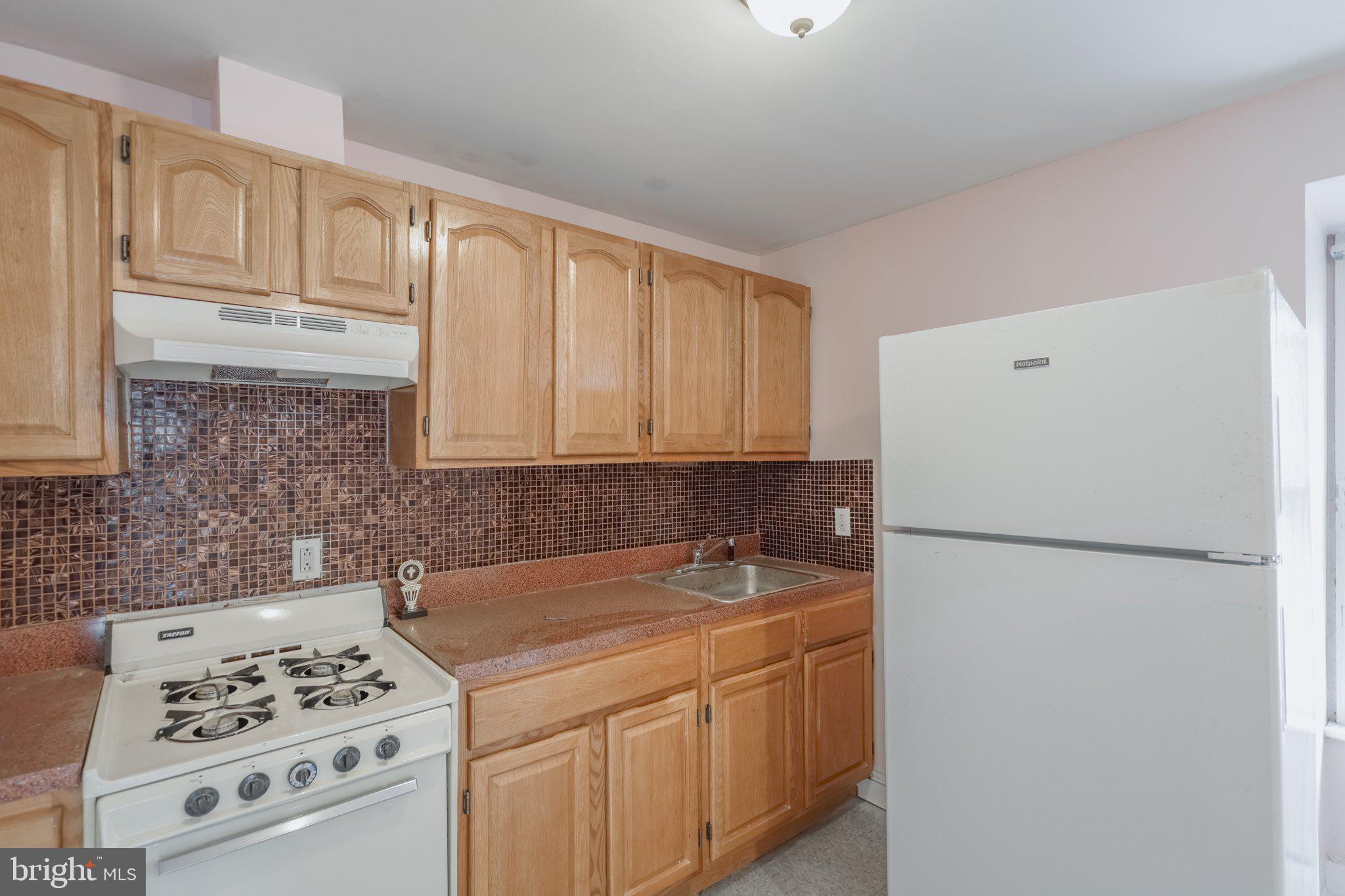 912 Ridge Avenue Darby, PA 19023 - Photo 16 of 28 Charming kitchen with warm wood tones.