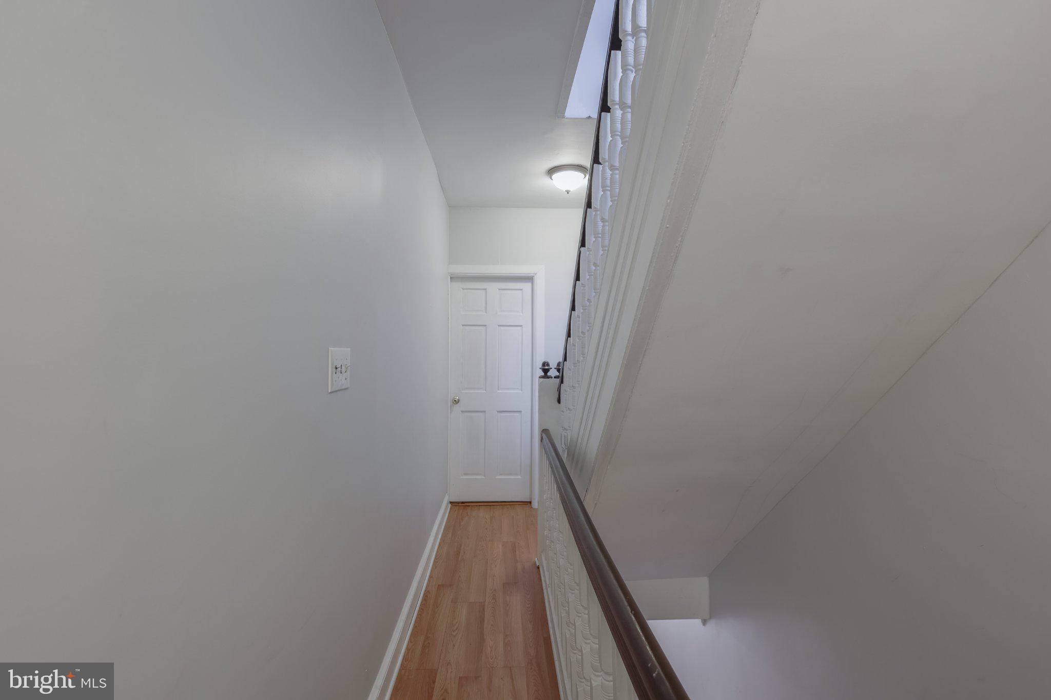 912 Ridge Avenue Darby, PA 19023 - Photo 21 of 28 Bright and inviting hallway ascent.