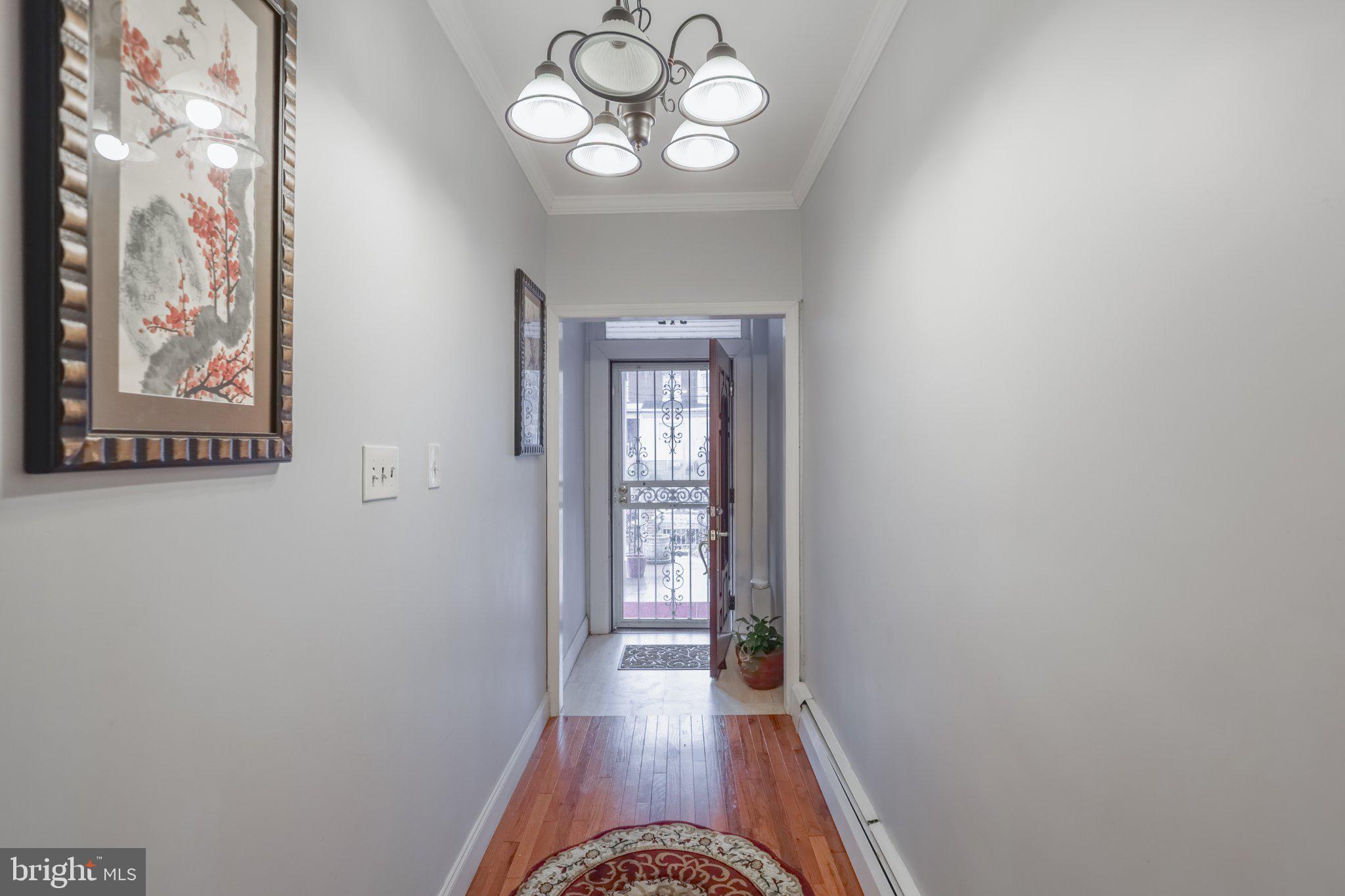 912 Ridge Avenue Darby, PA 19023 - Photo 22 of 28 Inviting hallway with warm accents.