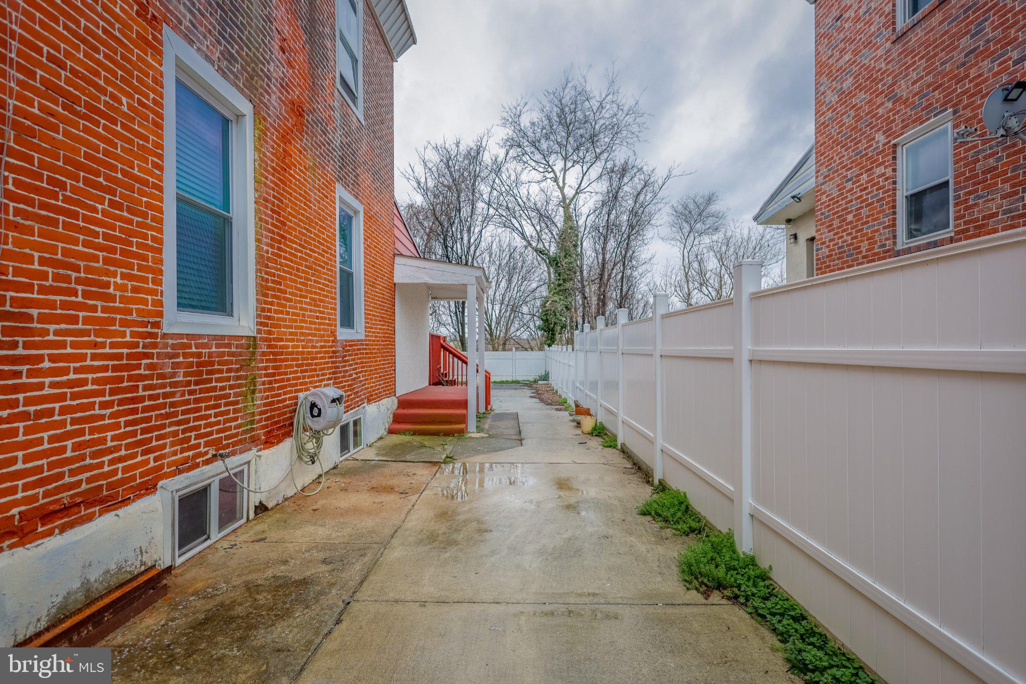 912 Ridge Avenue Darby, PA 19023 - Photo 26 of 28 Charming alleyway with brick accents.