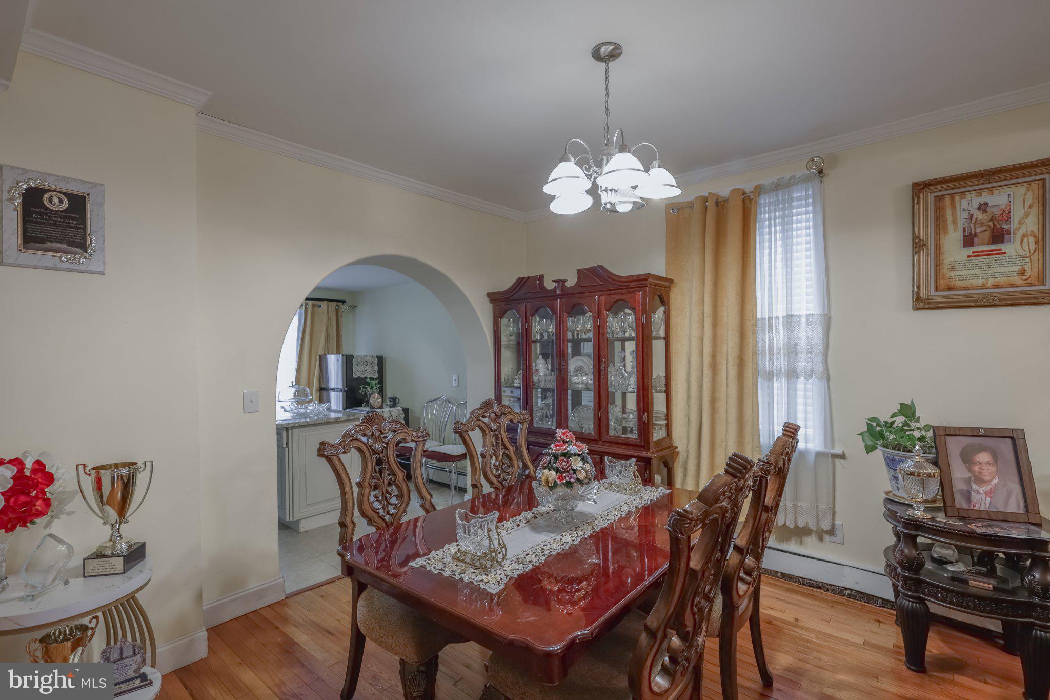 912 Ridge Avenue Darby, PA 19023 - Photo 6 of 28 Elegant dining space with warm ambiance.