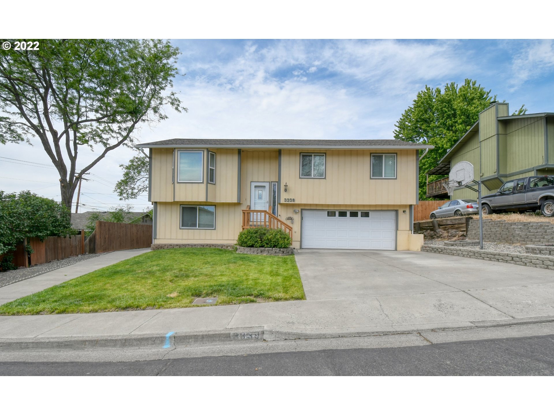 3339 Southwest Ladow Avenue Pendleton, OR 97801 - Photo 1 of 32 a front view of a house with a yard and garage