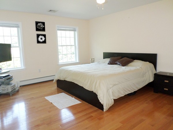 580 R Water Street Framingham, MA 01701 - Photo 8 of 17 a bedroom with a bed and a window
