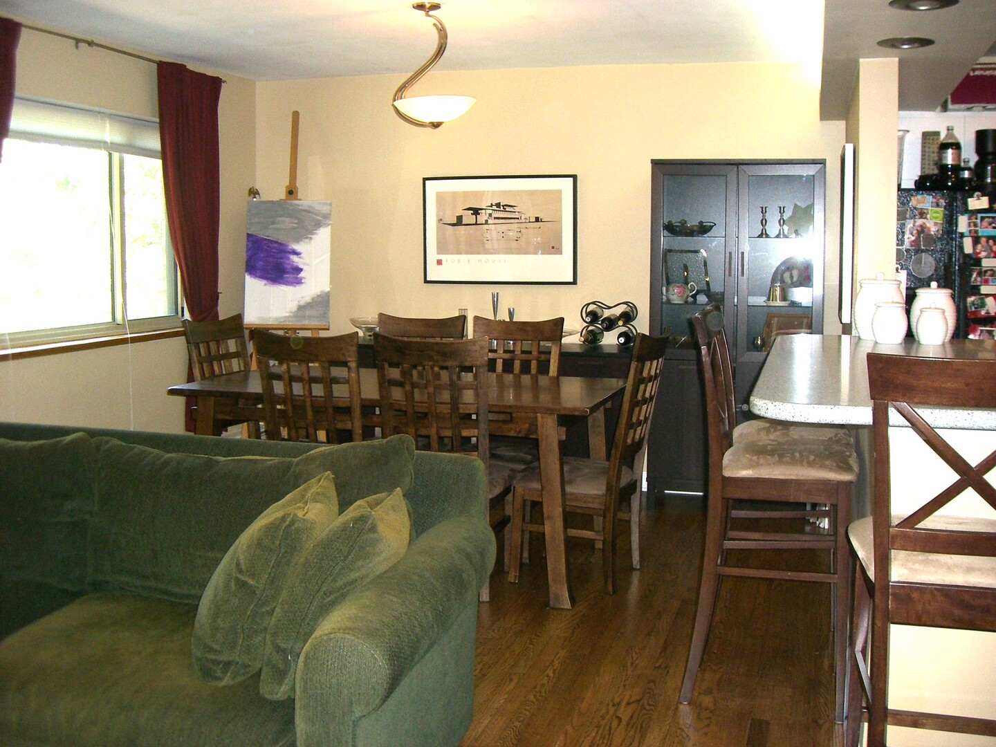 737 Ridge Avenue, Unit 2E Evanston, IL 60202 - Photo 3 of 9 a living room with furniture a large window and wooden floor