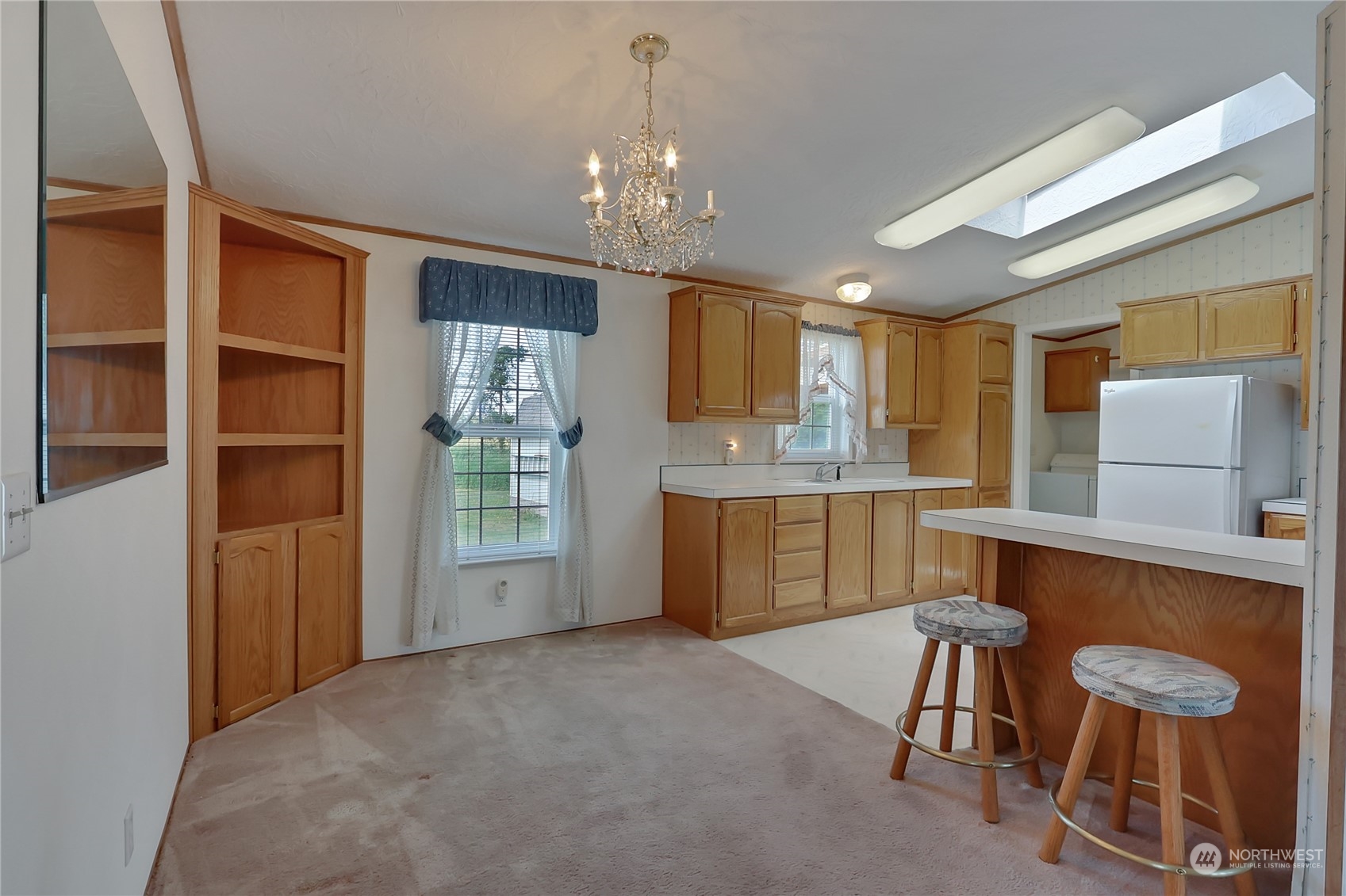 43205 196th Avenue Southeast Enumclaw, WA 98022 - Photo 13 of 30 a large kitchen with a table and chairs in it