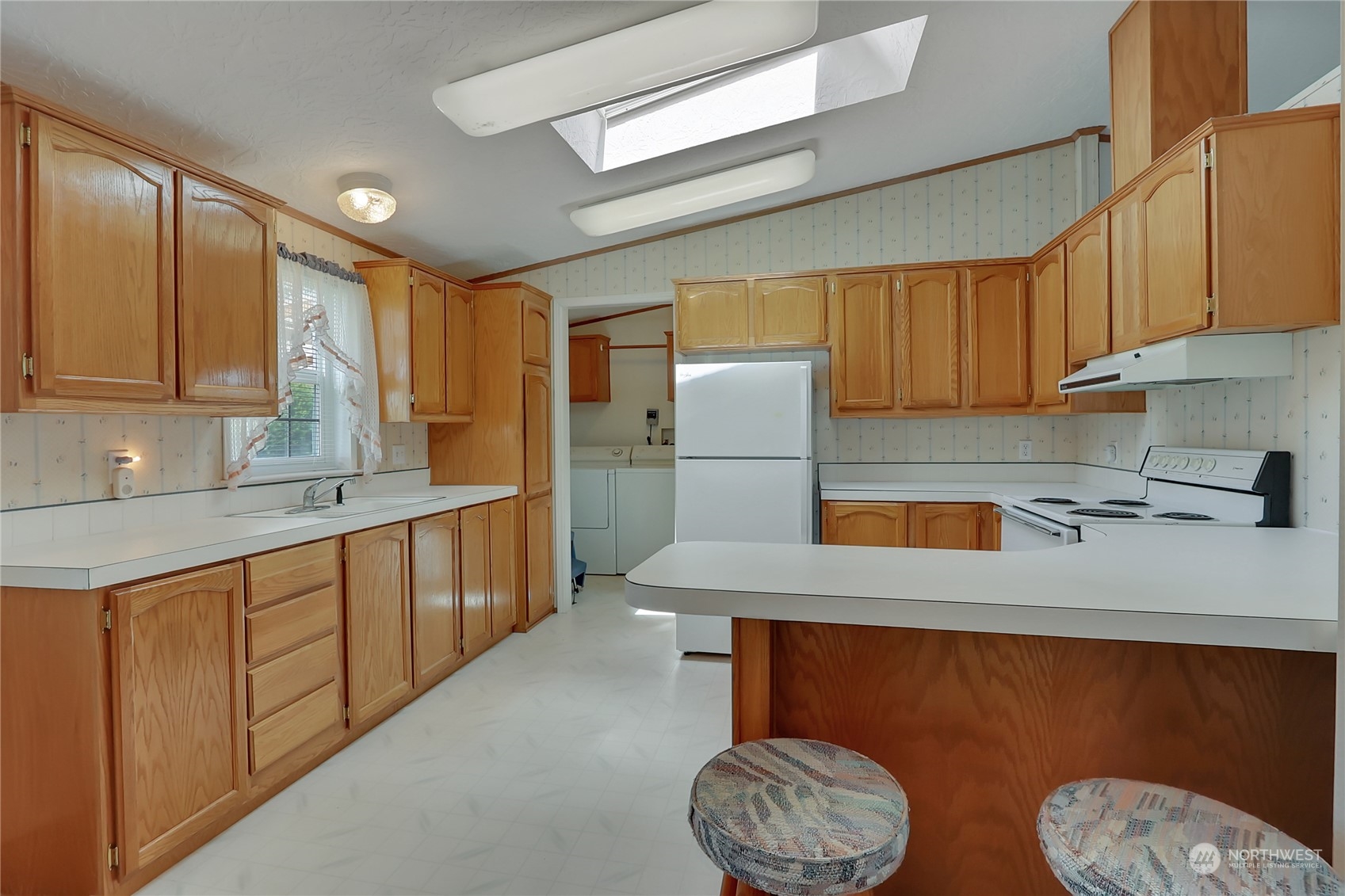 43205 196th Avenue Southeast Enumclaw, WA 98022 - Photo 14 of 30 a kitchen with refrigerator and cabinets