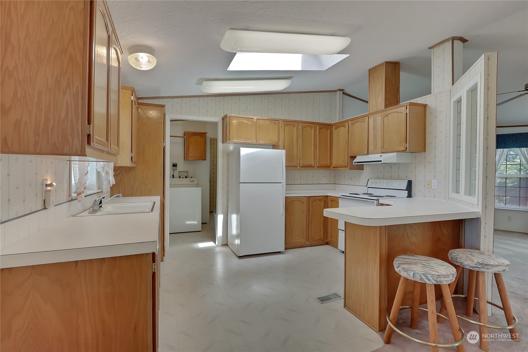 43205 196th Avenue Southeast Enumclaw, WA 98022 - Photo 16 of 30 a kitchen with a sink cabinets and refrigerator