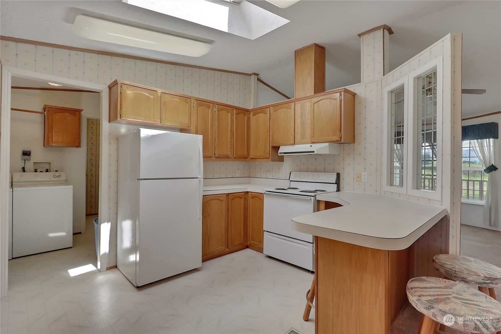 43205 196th Avenue Southeast Enumclaw, WA 98022 - Photo 17 of 30 a kitchen with sink refrigerator and microwave