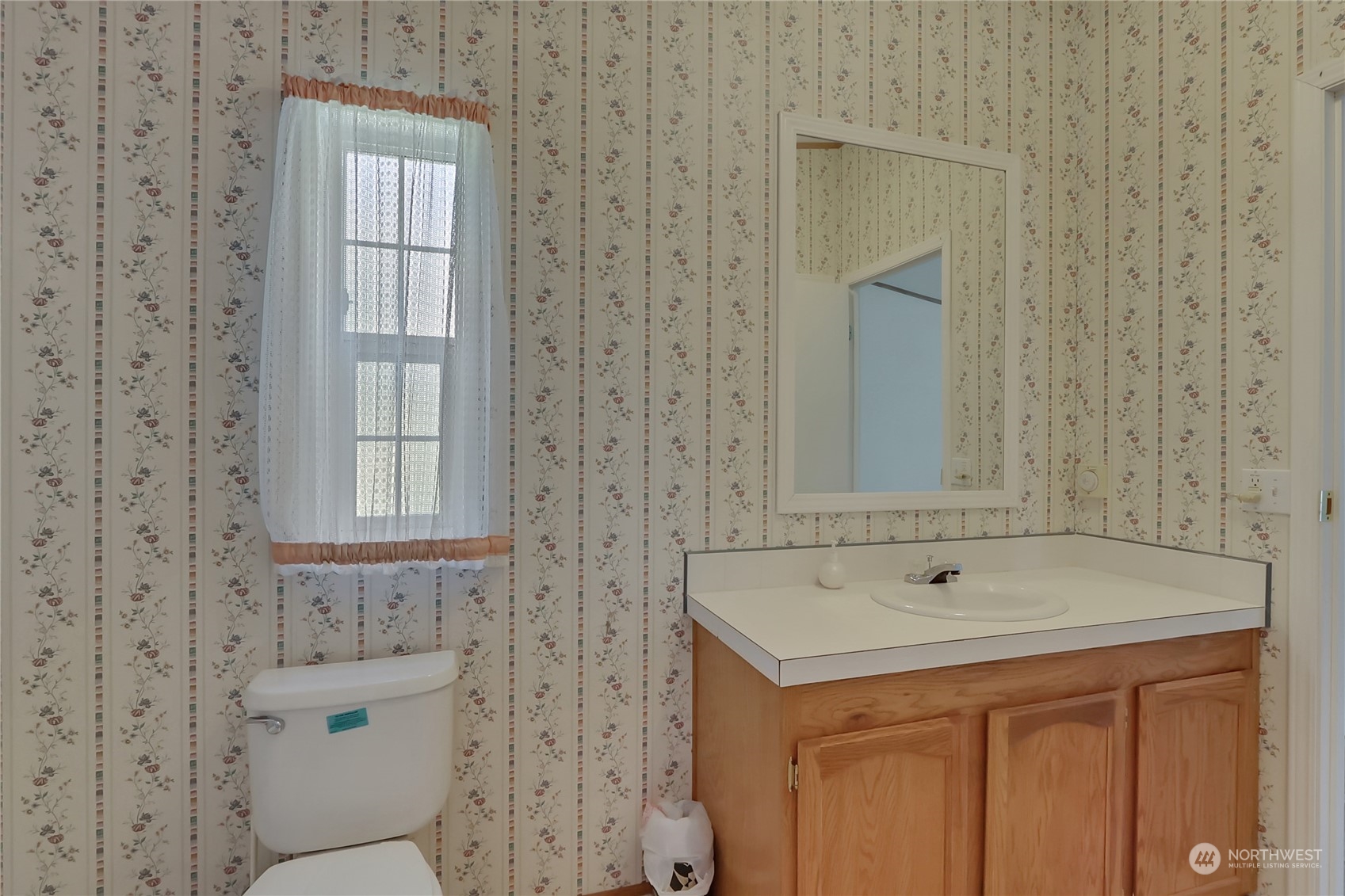 43205 196th Avenue Southeast Enumclaw, WA 98022 - Photo 21 of 30 a bathroom with a sink a mirror and a shower