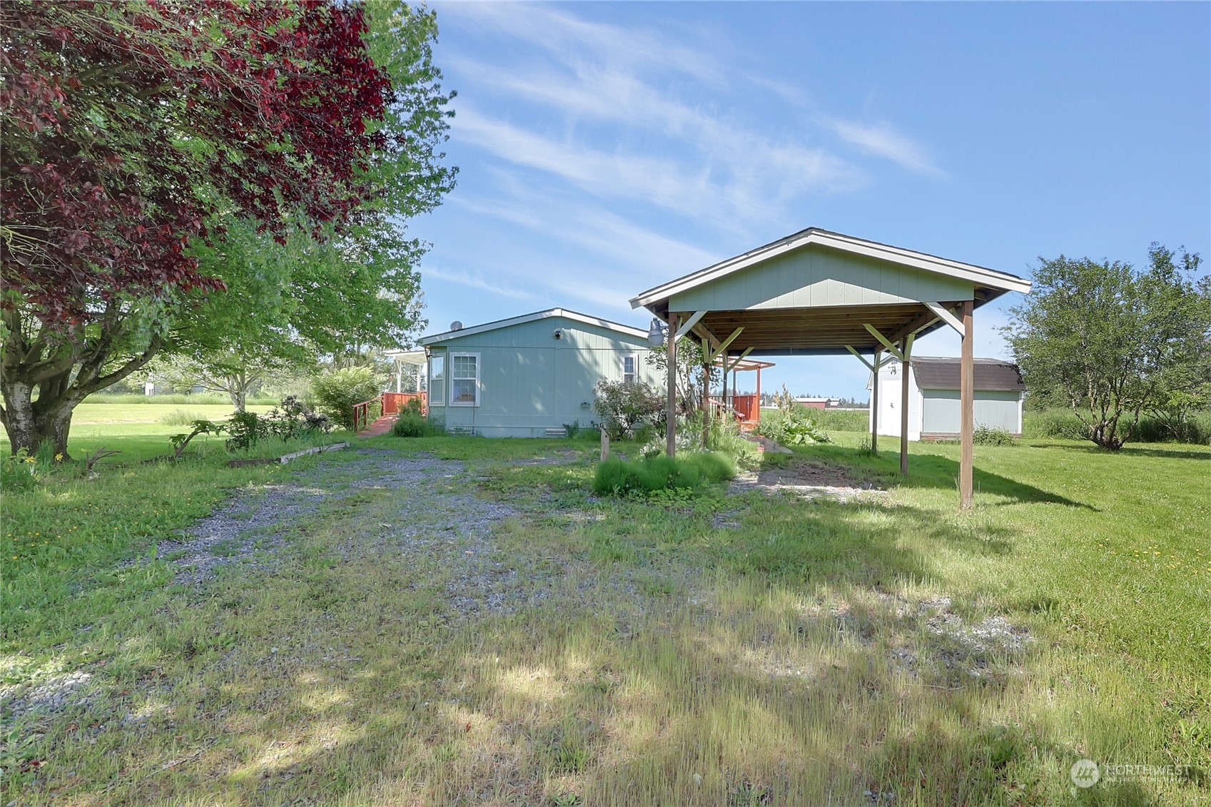43205 196th Avenue Southeast Enumclaw, WA 98022 - Photo 5 of 30 a view of a yard with a house and garden