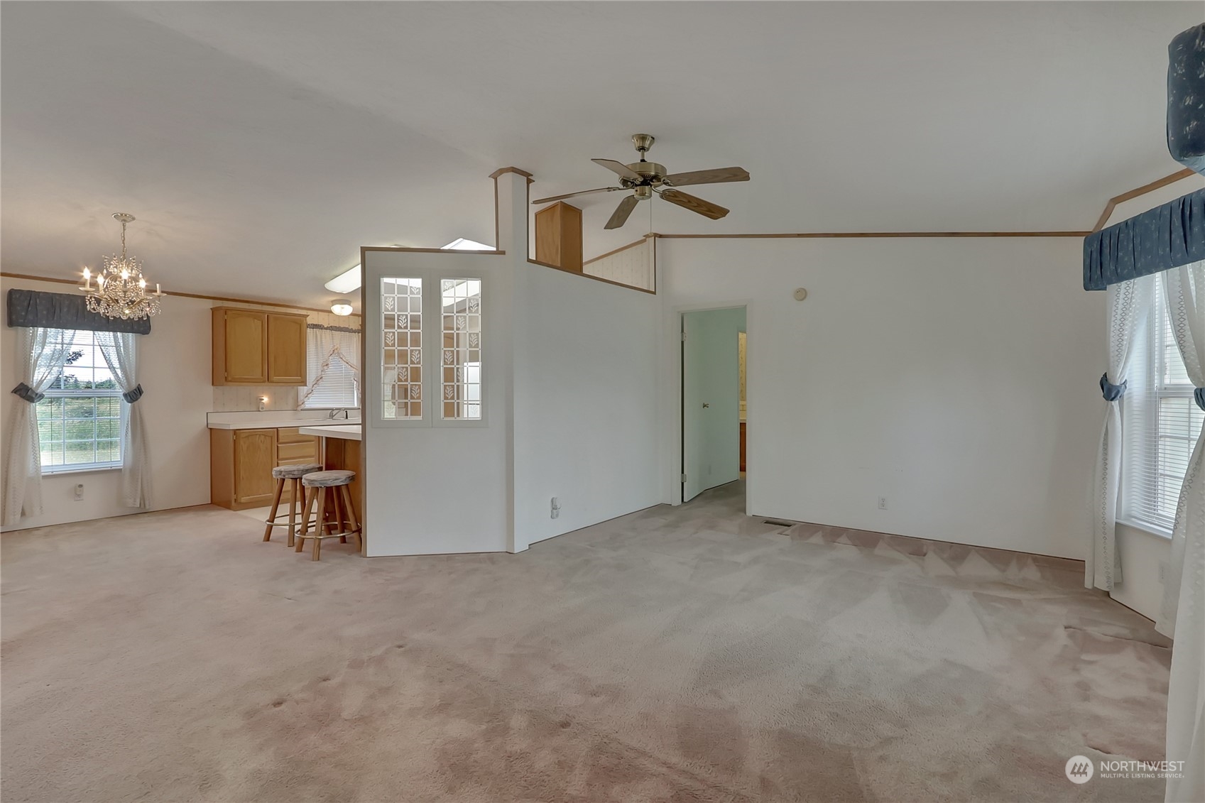43205 196th Avenue Southeast Enumclaw, WA 98022 - Photo 8 of 30 a view of a livingroom with furniture and a ceiling fan