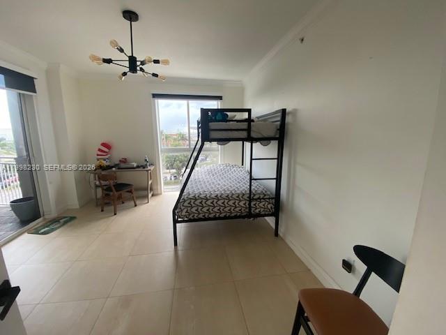 7270 Southwest 88th Street, Unit B306 Miami, FL 33156 - Photo 14 of 25 a bedroom with furniture and a window