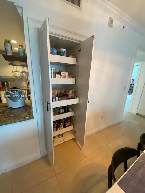 7270 Southwest 88th Street, Unit B306 Miami, FL 33156 - Photo 17 of 25 a view of walk in closet with clothes and shoes