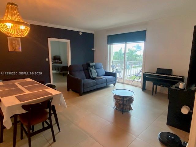 7270 Southwest 88th Street, Unit B306 Miami, FL 33156 - Photo 7 of 25 a living room with couches a coffee table and four couches next to a window