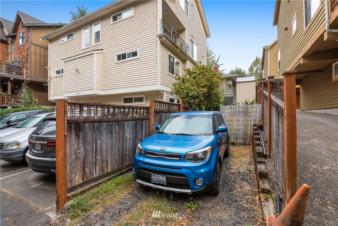 929 North 35th Street Seattle, WA 98103 - Photo 13 of 17 a backyard of a house with outdoor seating