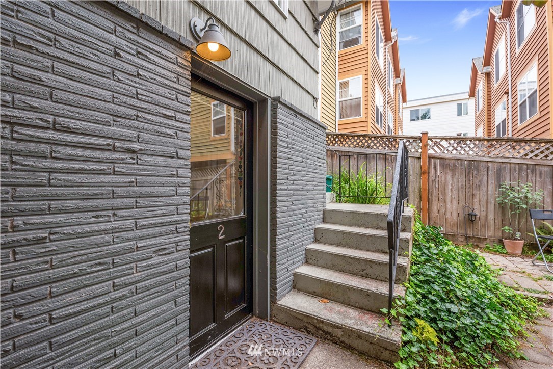 929 North 35th Street Seattle, WA 98103 - Photo 15 of 17 a view of a pathway of a house with wooden stairs