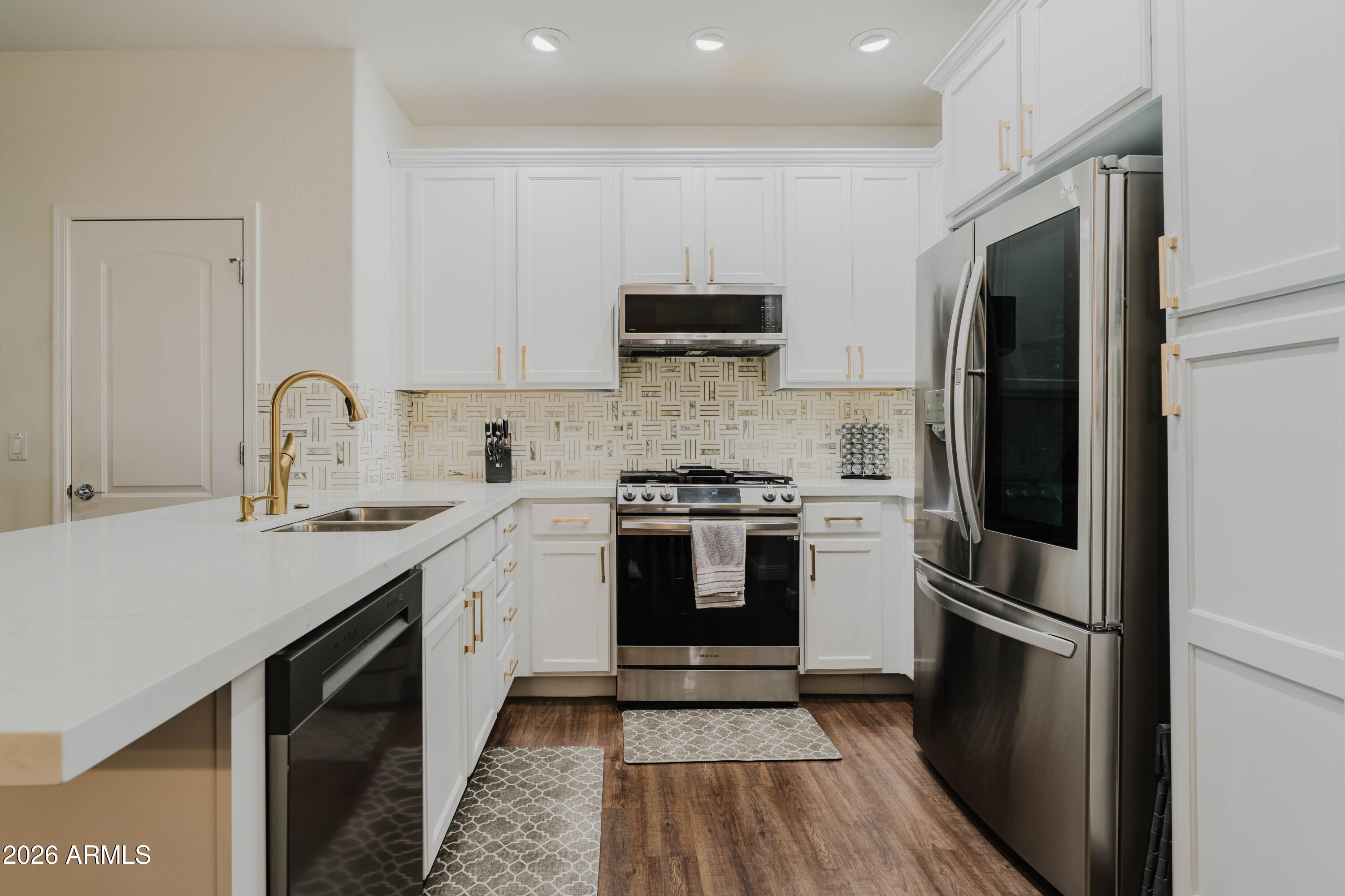 5550 North 16th Street, Unit 131 Phoenix, AZ 85016 - Photo 2 of 25 a kitchen with a sink stove and refrigerator
