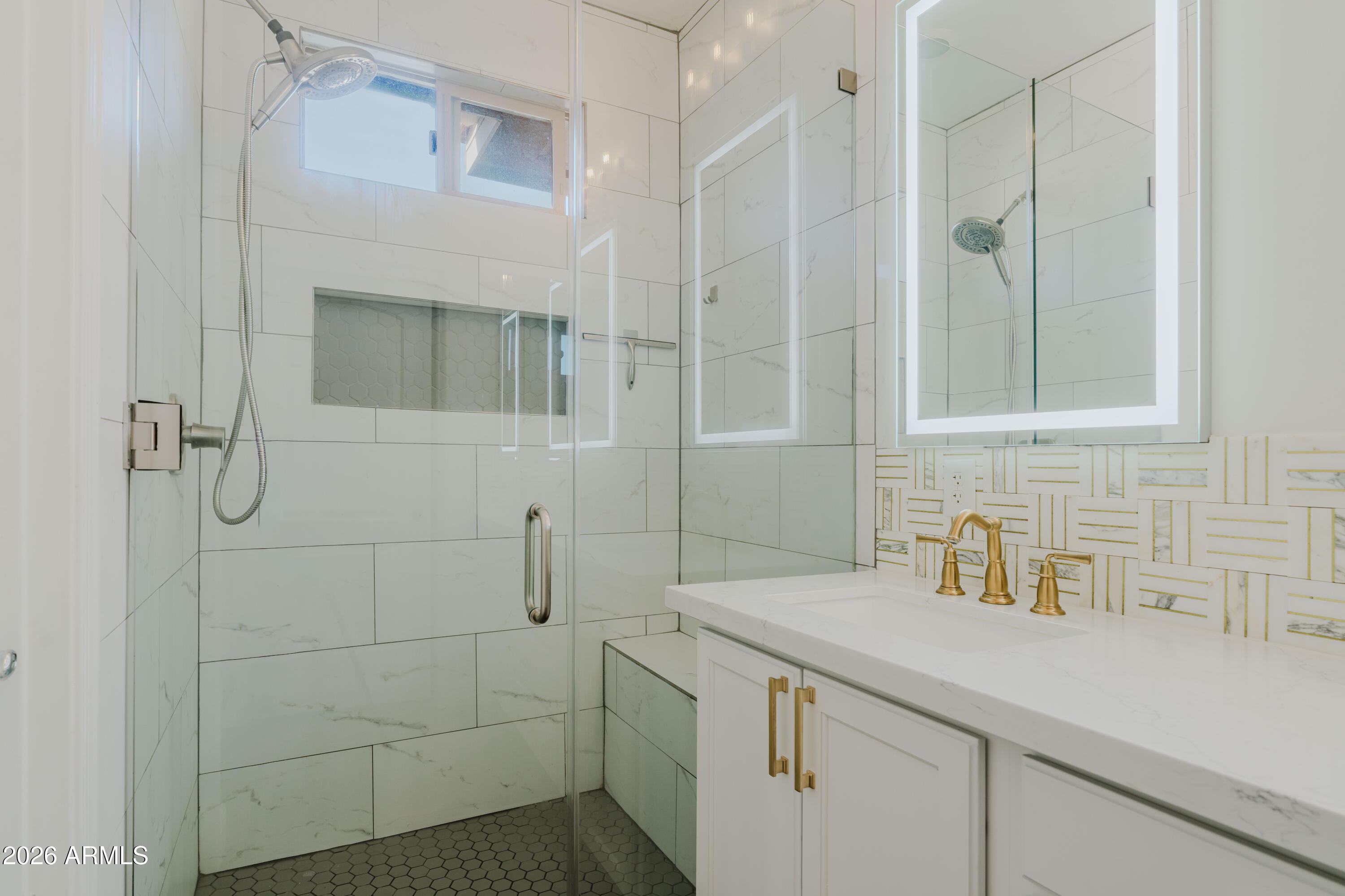5550 North 16th Street, Unit 131 Phoenix, AZ 85016 - Photo 8 of 25 a bathroom with a shower sink and vanity