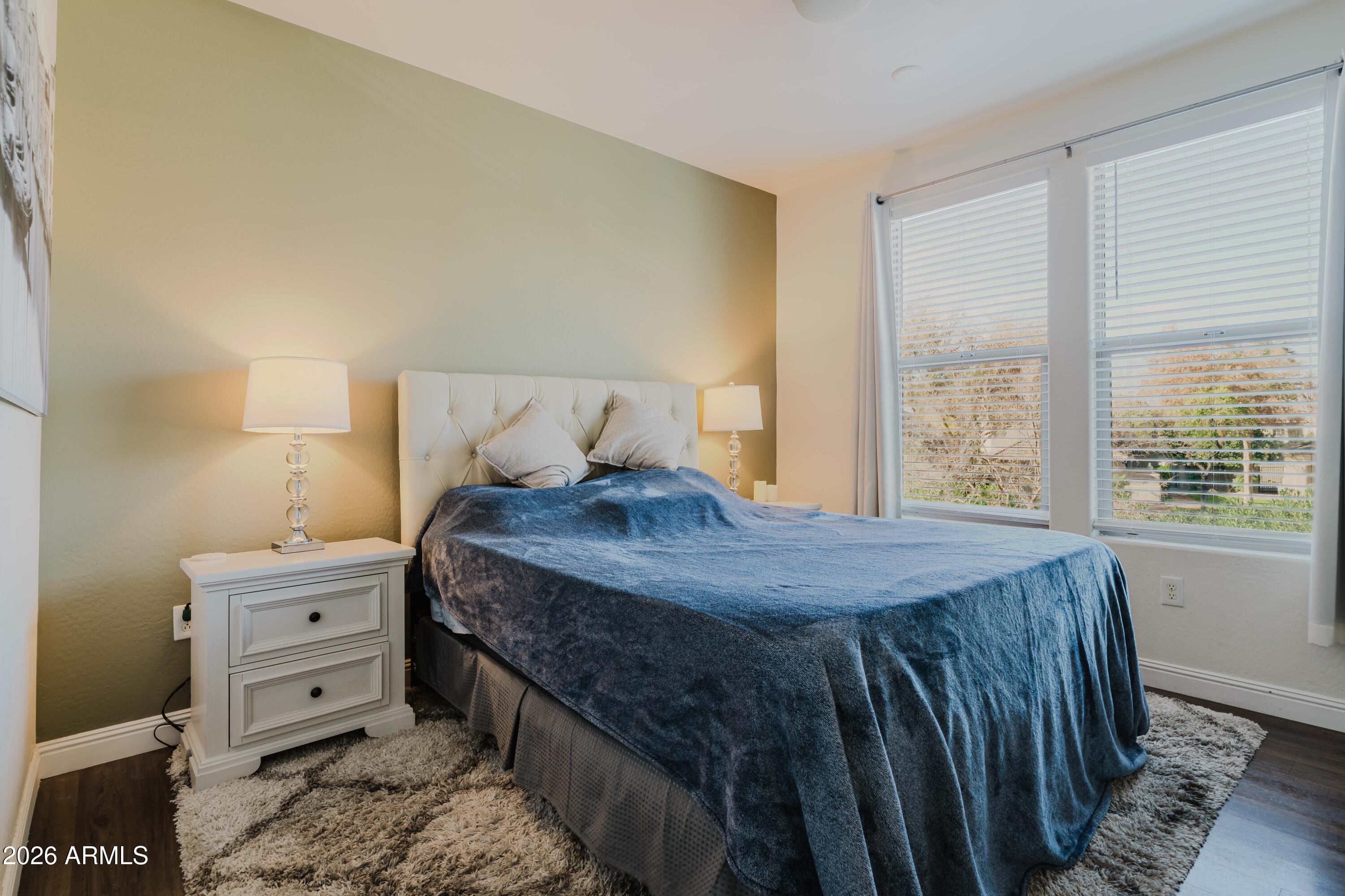 5550 North 16th Street, Unit 131 Phoenix, AZ 85016 - Photo 9 of 25 a bedroom with a bed and a window