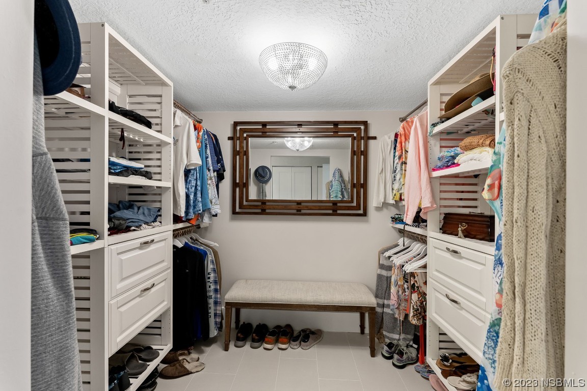 4650 Links Village Drive, Unit A301 Ponce Inlet, FL 32127 - Photo 18 of 54 a living room with furniture and a flat screen tv