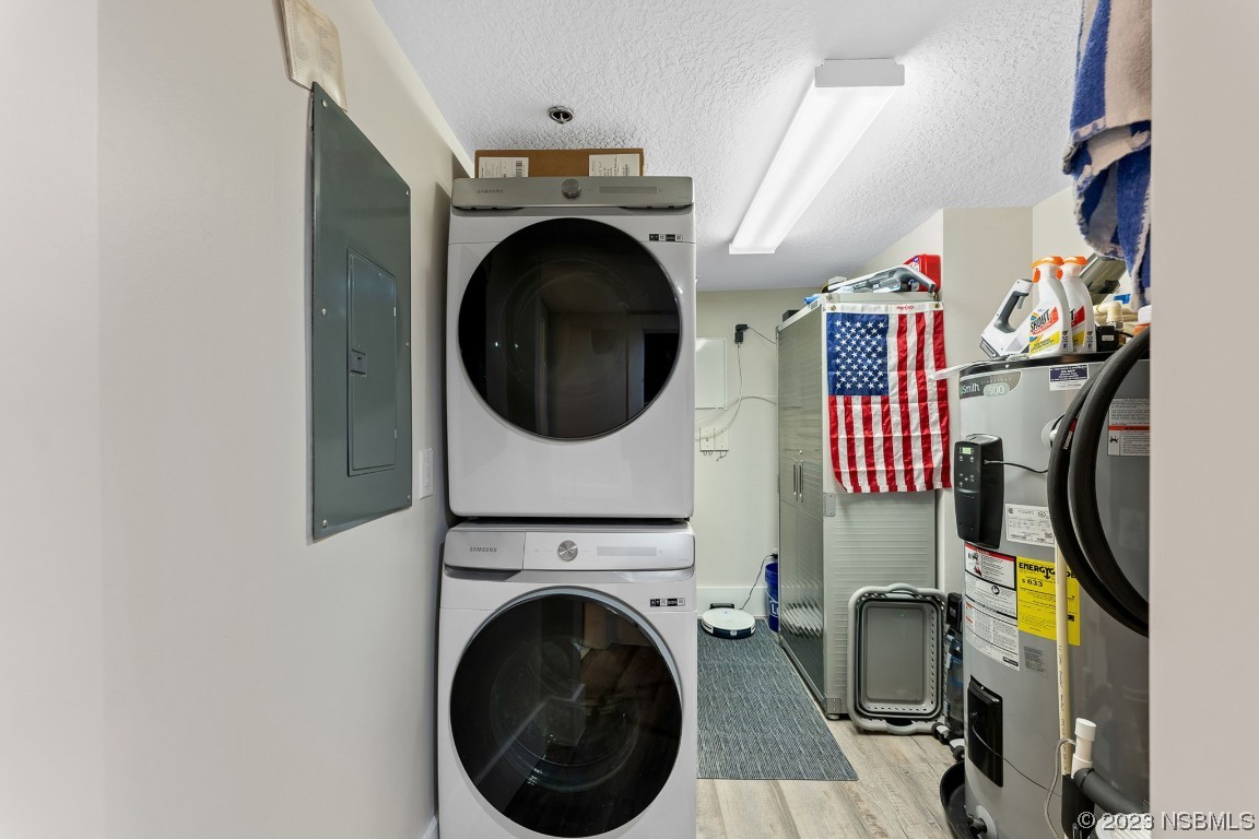 4650 Links Village Drive, Unit A301 Ponce Inlet, FL 32127 - Photo 30 of 54 a view of a storage & utility room with washer and dryer