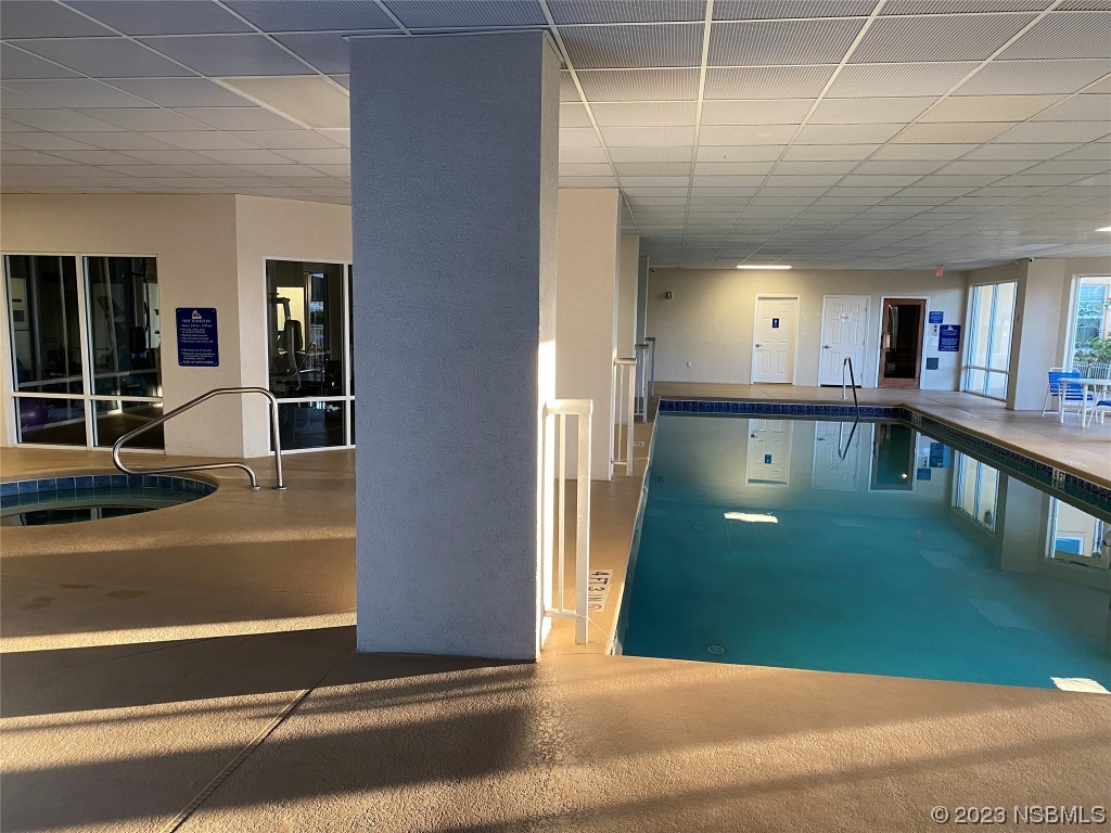 4650 Links Village Drive, Unit A301 Ponce Inlet, FL 32127 - Photo 34 of 54 a view of a living room and bathroom