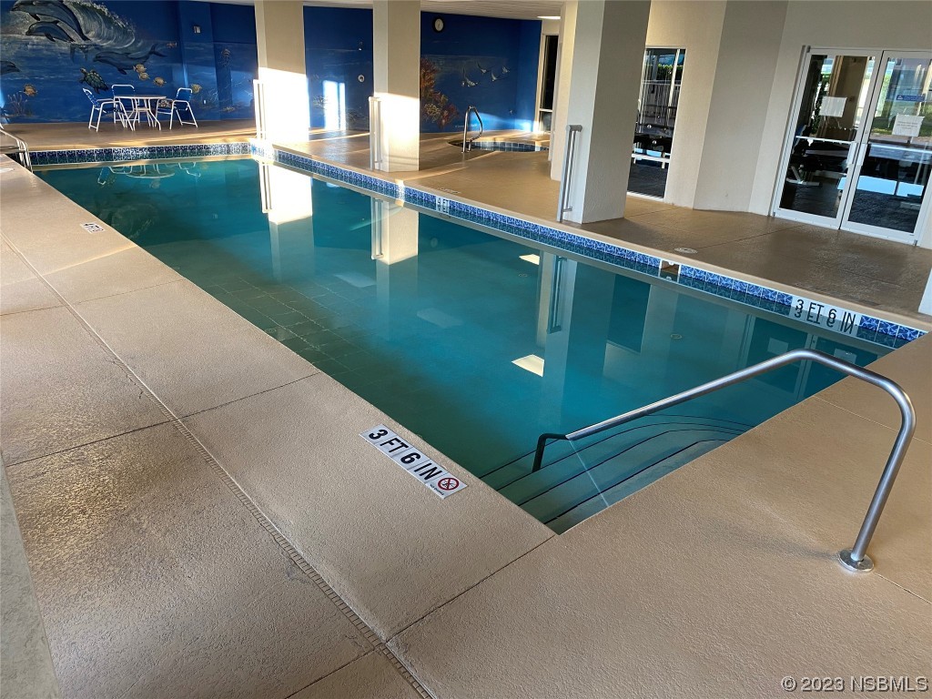 4650 Links Village Drive, Unit A301 Ponce Inlet, FL 32127 - Photo 35 of 54 a view of swimming pool with outdoor seating