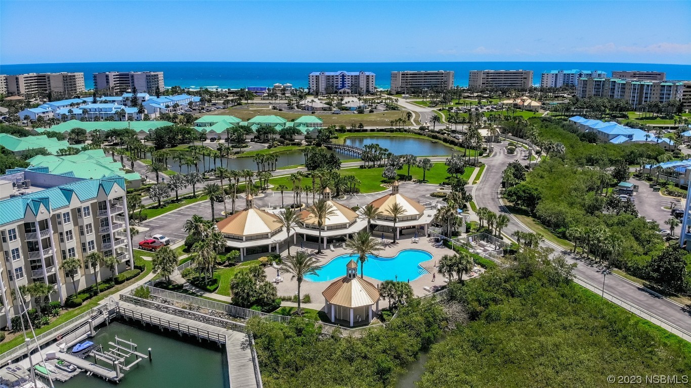 4650 Links Village Drive, Unit A301 Ponce Inlet, FL 32127 - Photo 45 of 54 a view of a lake with a city