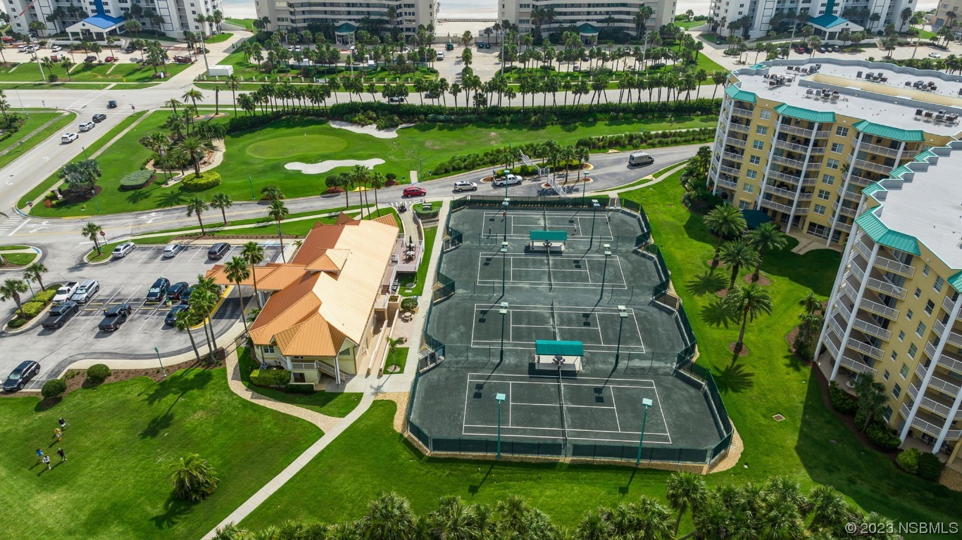 4650 Links Village Drive, Unit A301 Ponce Inlet, FL 32127 - Photo 49 of 54 an aerial view of a residential houses with outdoor space and a lake view