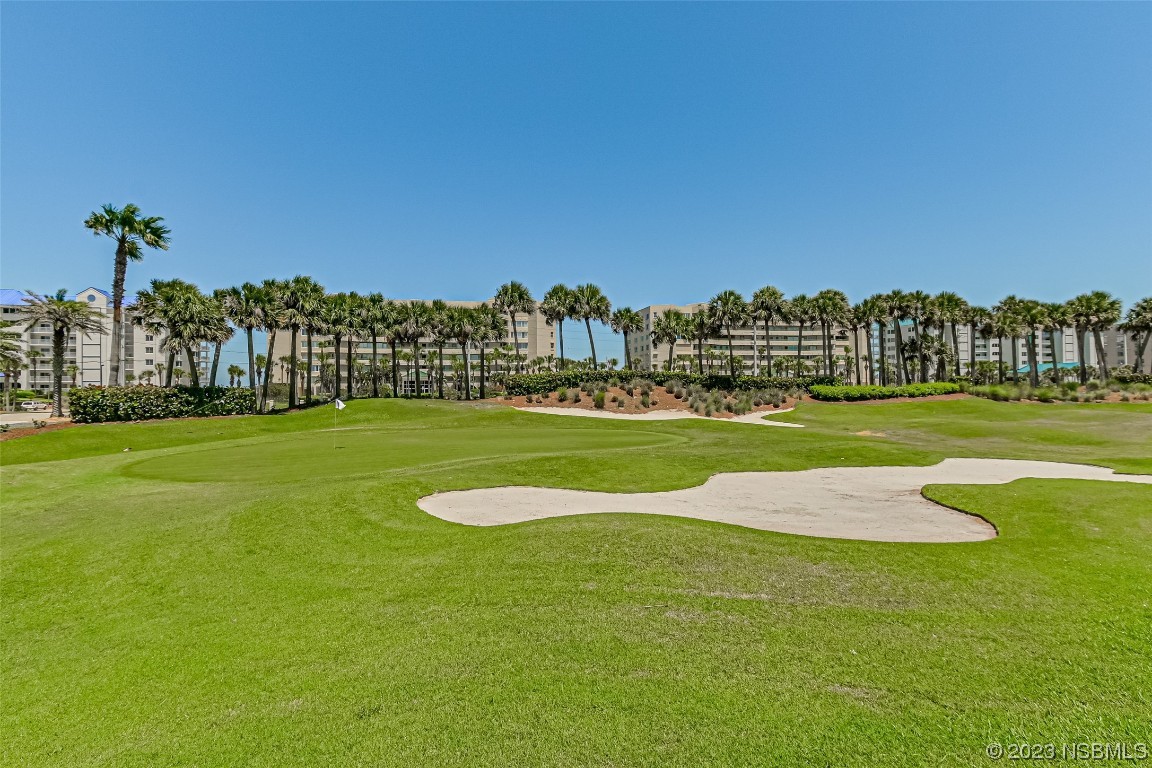 4650 Links Village Drive, Unit A301 Ponce Inlet, FL 32127 - Photo 52 of 54 a view of a golf course with a house