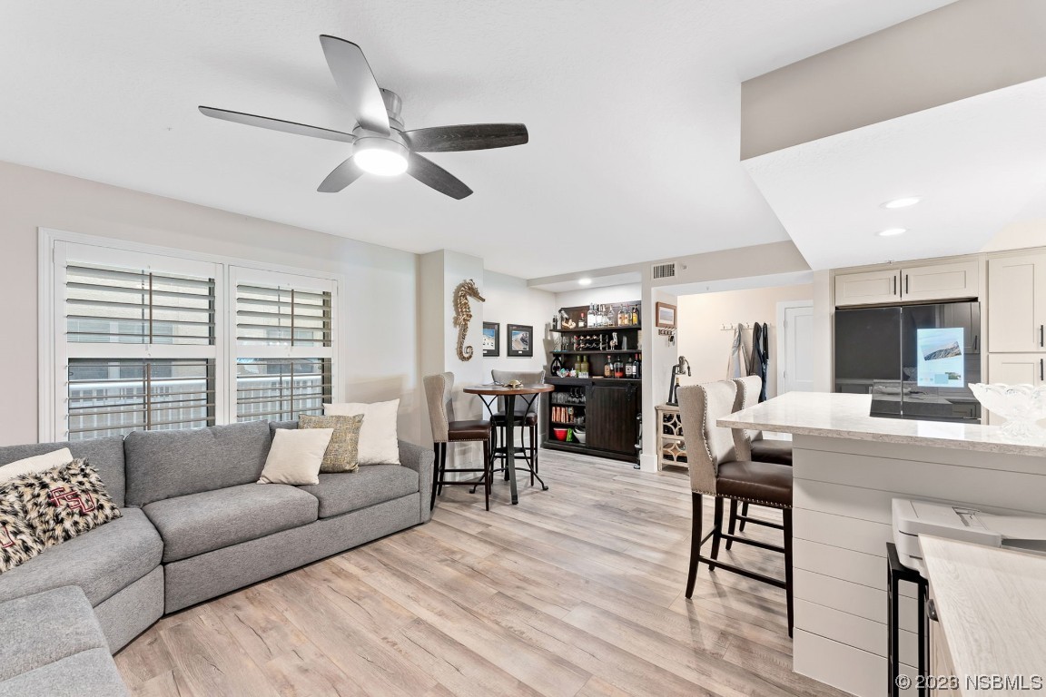 4650 Links Village Drive, Unit A301 Ponce Inlet, FL 32127 - Photo 8 of 54 a living room with furniture and a wooden floor