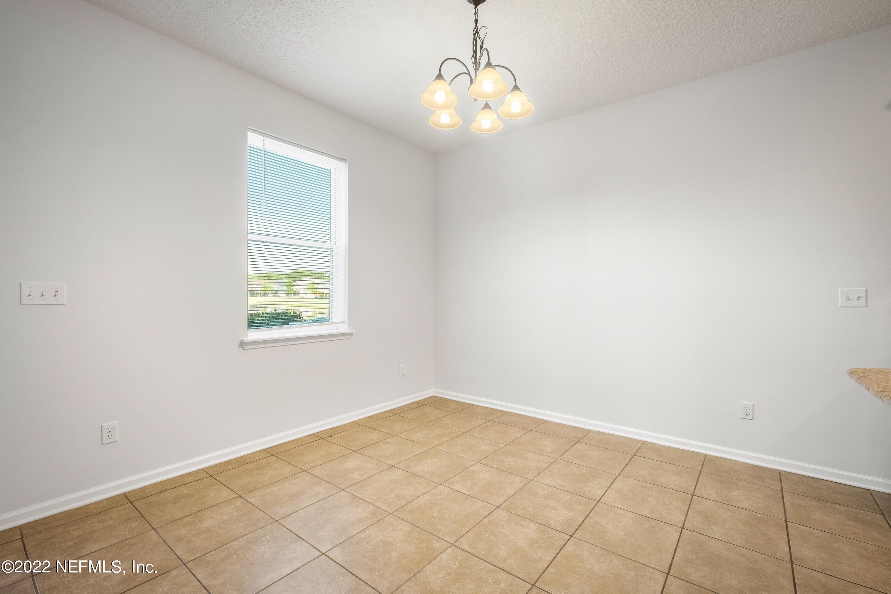 157 Heron Landing Road St. Johns, FL 32259 - Photo 11 of 40 an empty room with windows