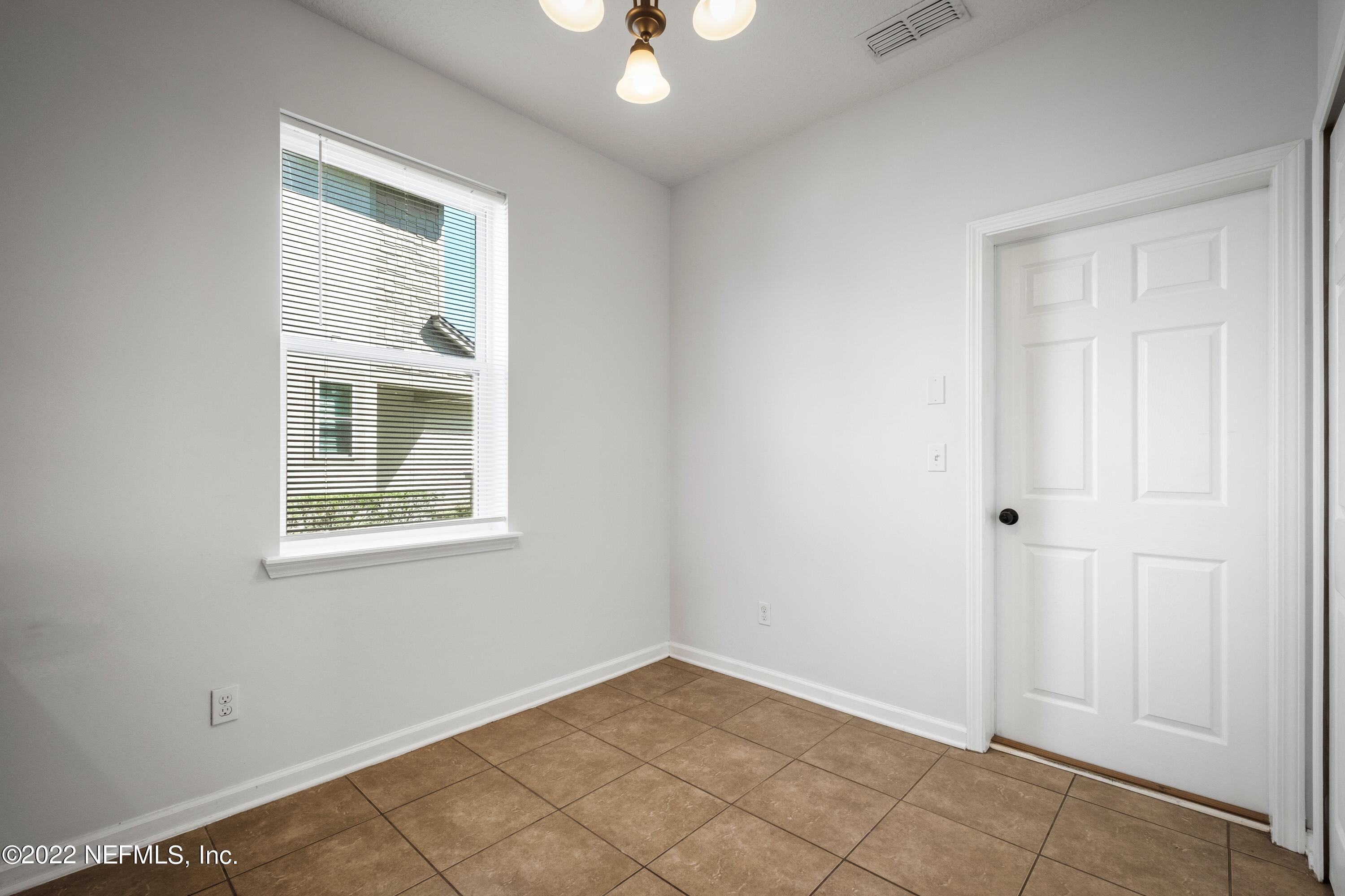 157 Heron Landing Road St. Johns, FL 32259 - Photo 18 of 40 an empty room with windows and closet