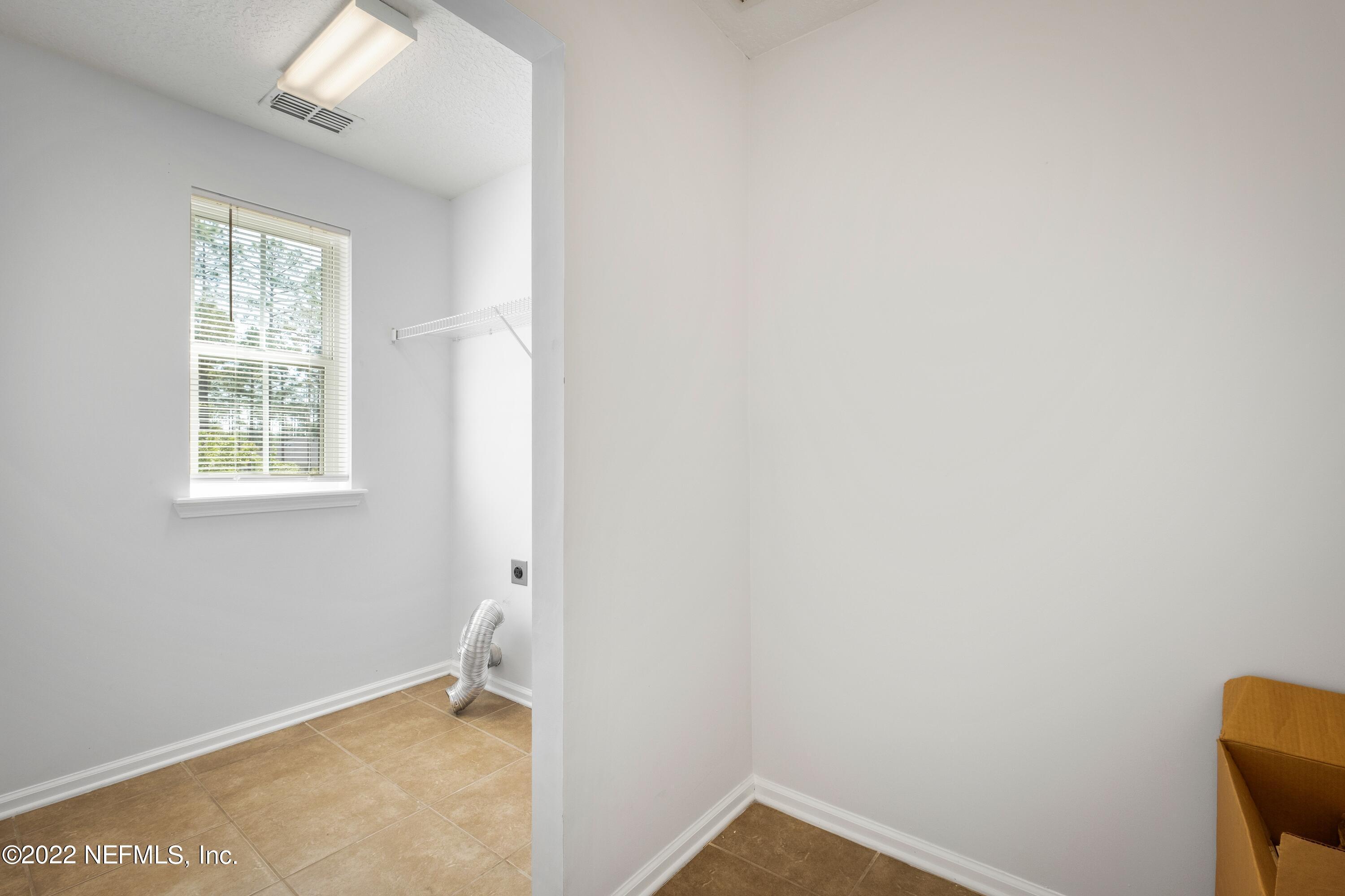 157 Heron Landing Road St. Johns, FL 32259 - Photo 34 of 40 an empty room with a window