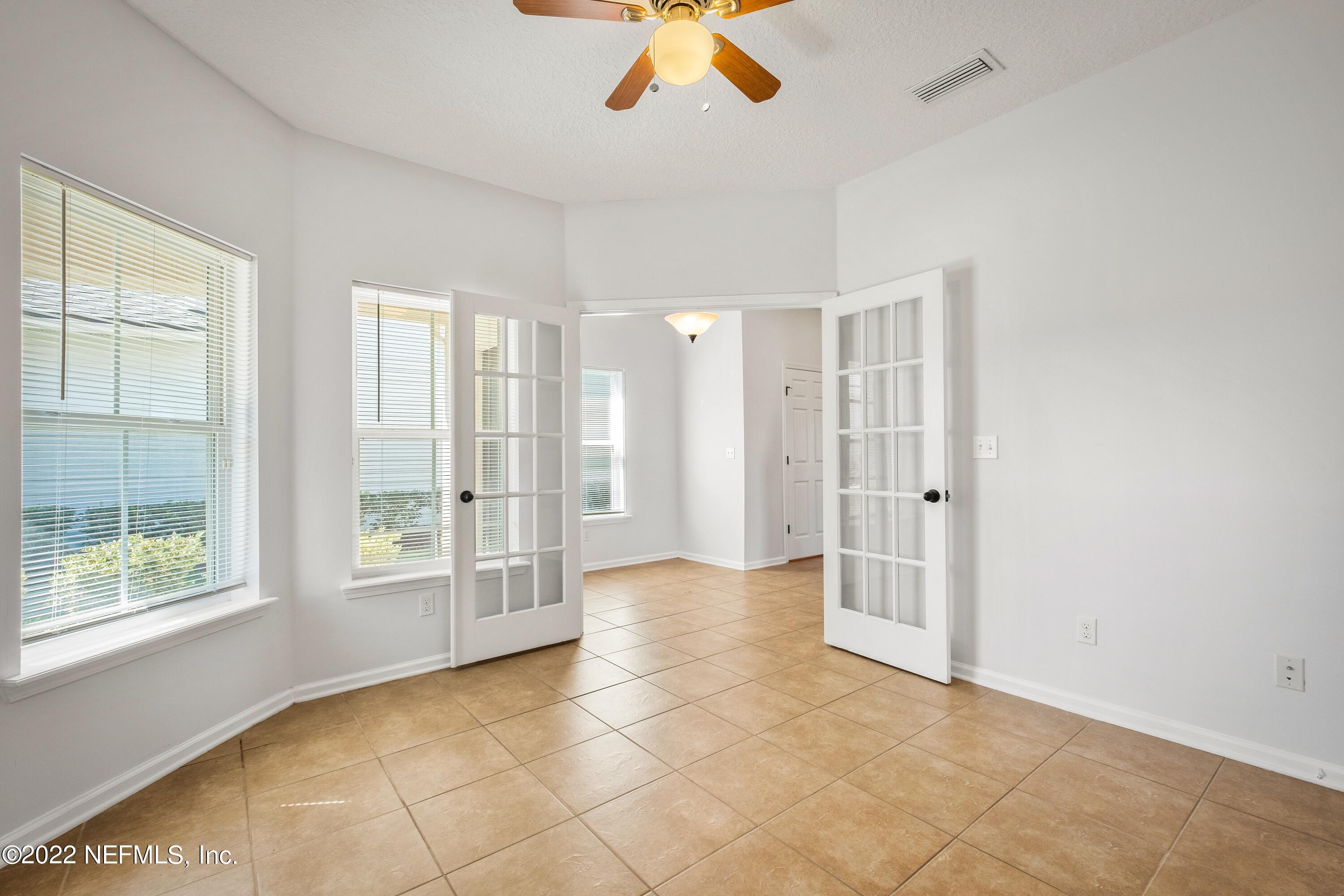 157 Heron Landing Road St. Johns, FL 32259 - Photo 5 of 40 a view of an empty room with a window