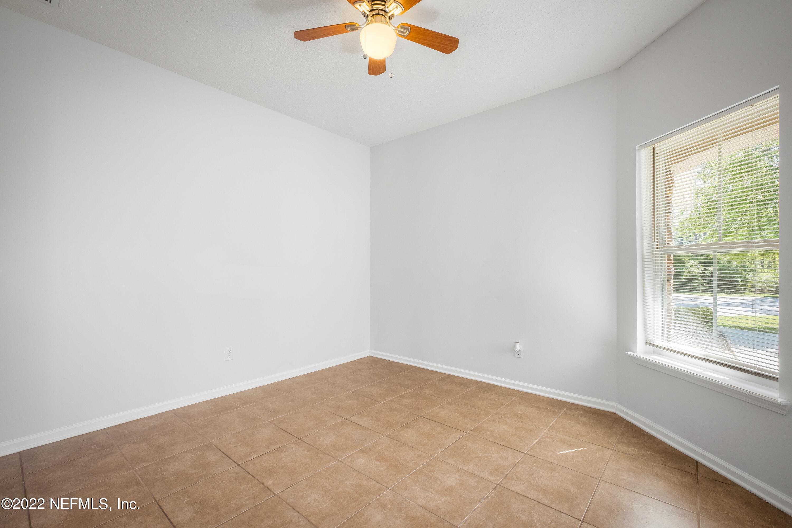 157 Heron Landing Road St. Johns, FL 32259 - Photo 6 of 40 an empty room with a window