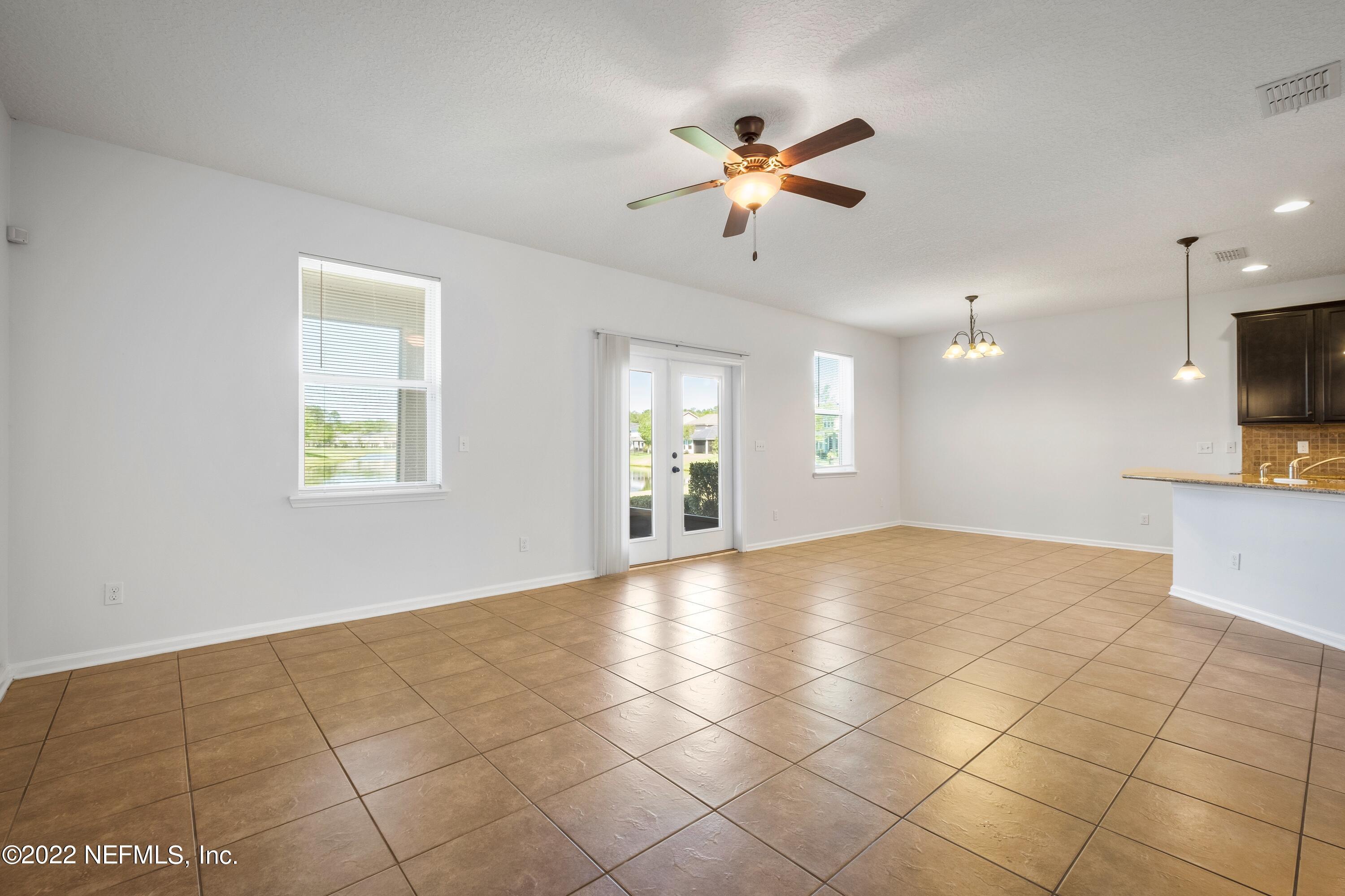 157 Heron Landing Road St. Johns, FL 32259 - Photo 7 of 40 a view of an empty room with a window