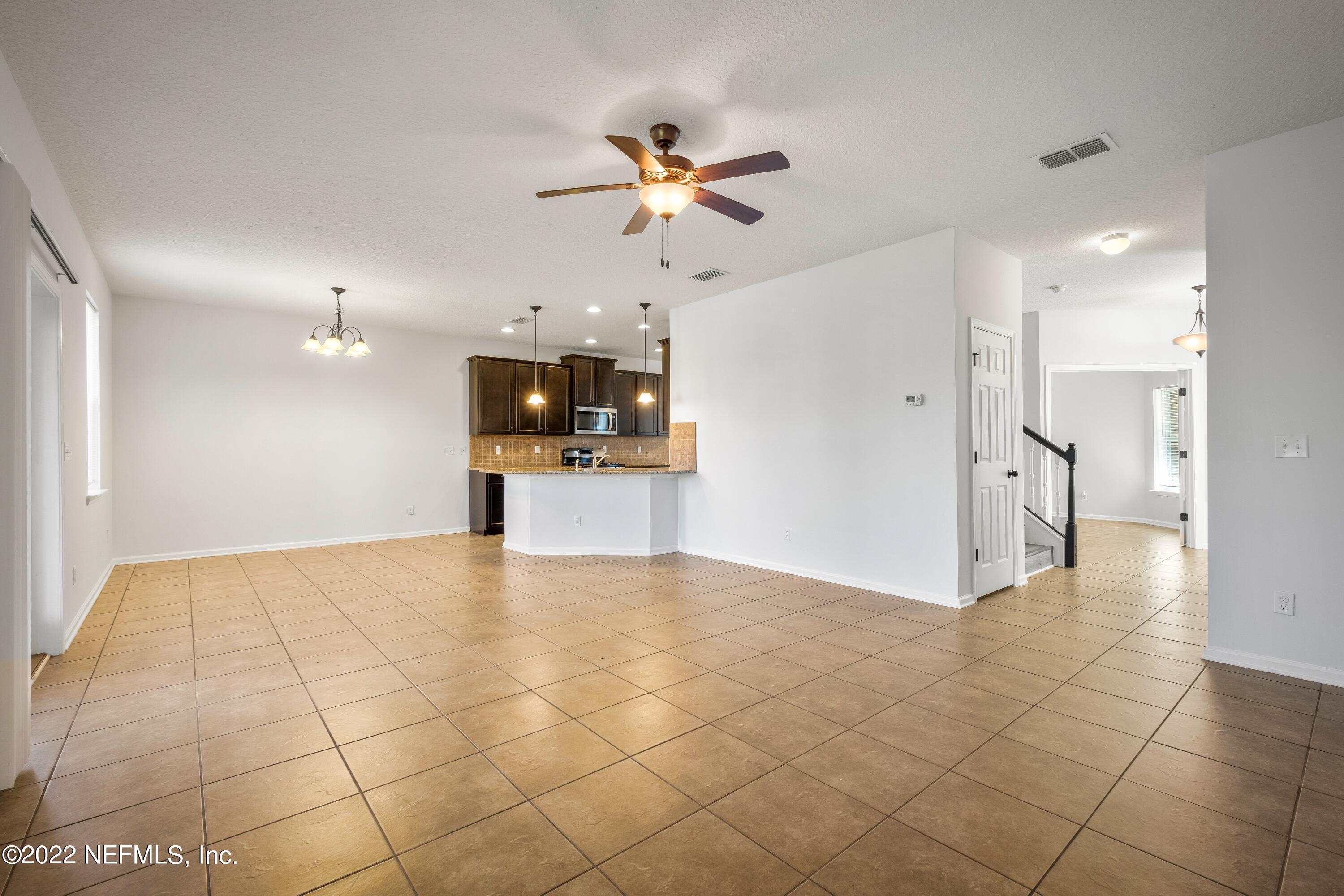 157 Heron Landing Road St. Johns, FL 32259 - Photo 8 of 40 a view of a kitchen with a sink and a refrigerator